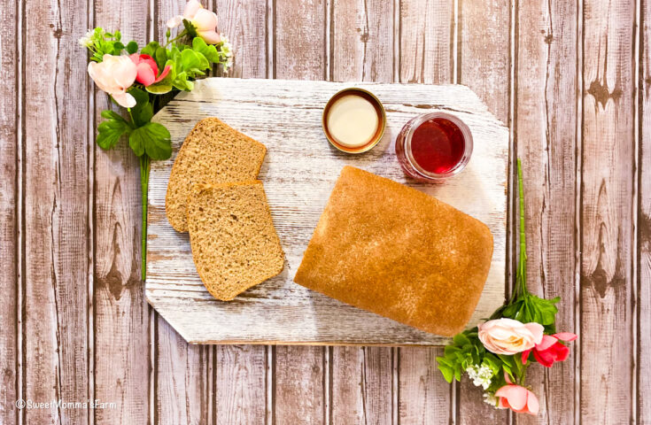 Fresh Homemade Bread sliced with homemade jam next to it.