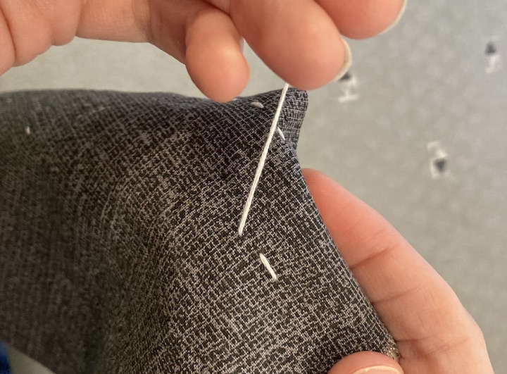 You put the next stitch in front of the previously made stitch and pull.