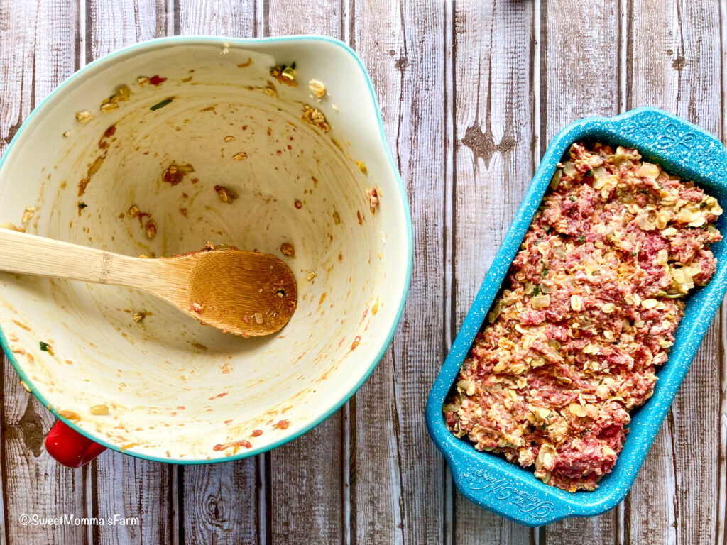 Raw meatloaf mixture put in a bread pan