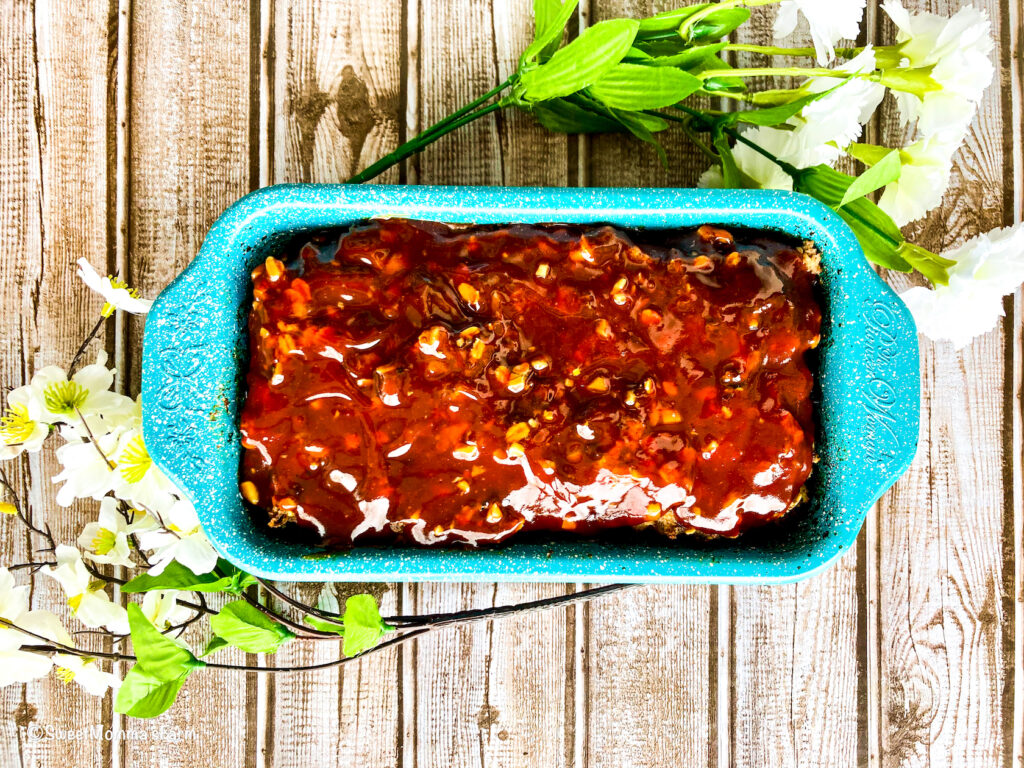 Veggie-Packed Meatloaf with Garlic Honey Sauce in a bread or loaf pan