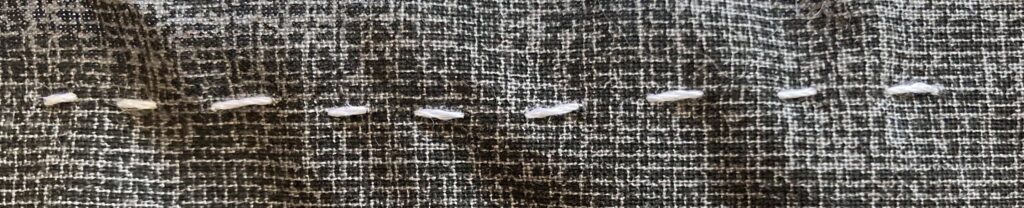 Close up a the basic hand stitch of the running stitch. How To Sew Basic Hand Stitches