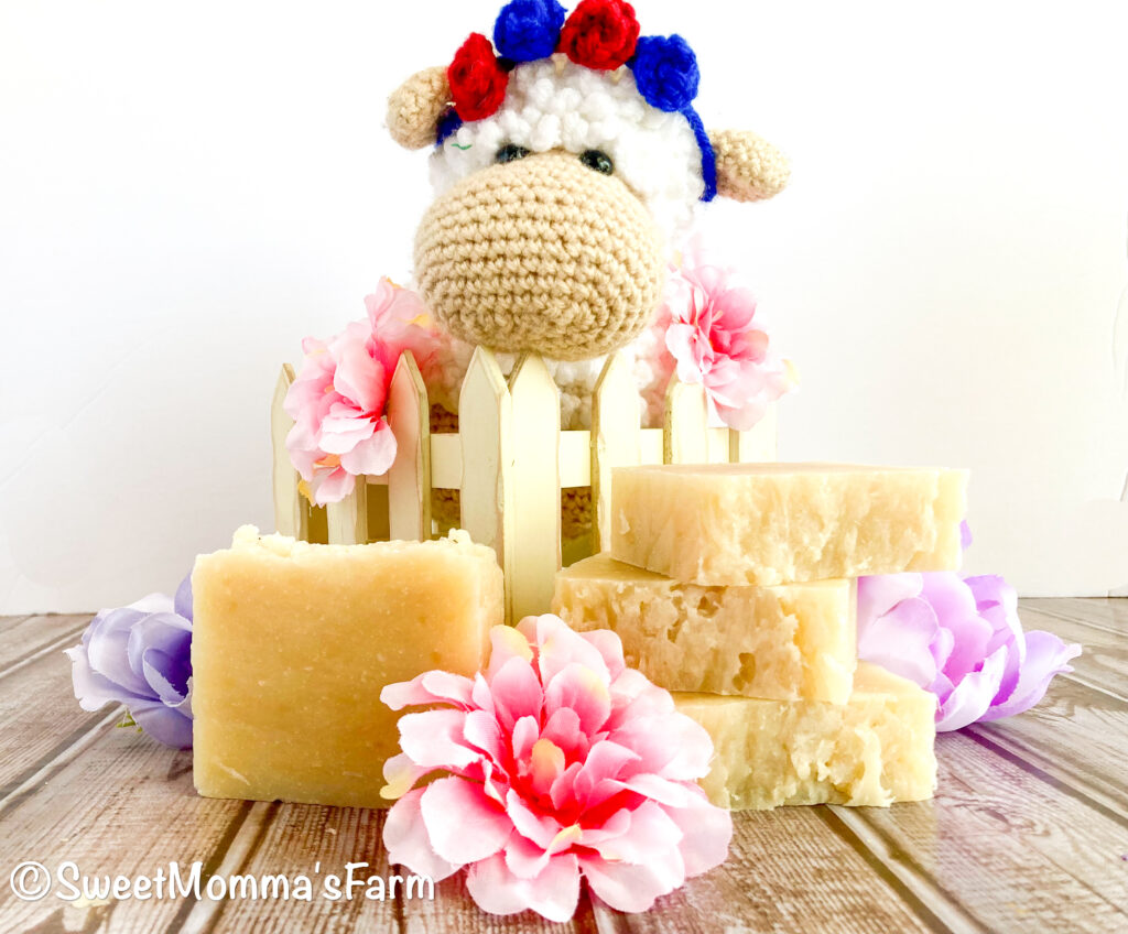 A crocheted sheep with a plain bar of hot process soap with no coloring or scents